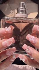 Person unboxes Givenchy perfume in Novosaratovka, Russia