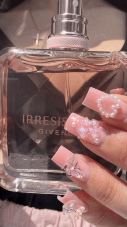 Person unboxes Givenchy perfume in Novosaratovka, Russia