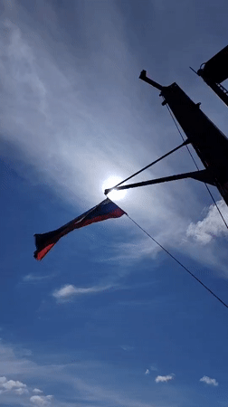 Russian flag and river barge documented in Kosino