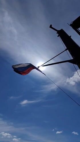 Russian flag and river barge documented in Kosino