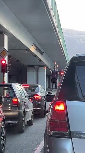 Torch-wielding figure on ladder stops traffic in Sofia