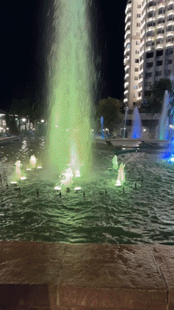 Almaty's city center at night, fountains and civic landmarks