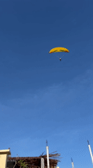 Coastal recreation day: paragliding, beach visits, motorcycles, dining documented