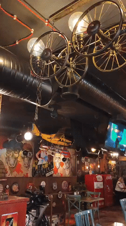 Industrial-themed restaurant in Yerevan features gaming decor, motorcycle display