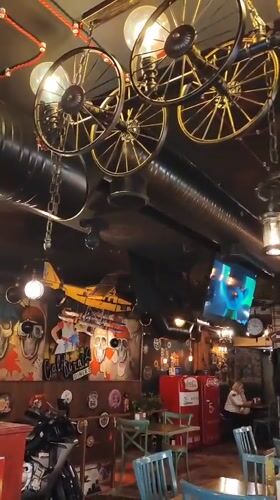 Industrial-themed restaurant in Yerevan features gaming decor, motorcycle display