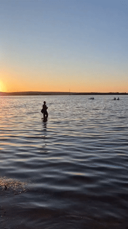 Sunset recreation captured along Voronezh Reservoir waterfront