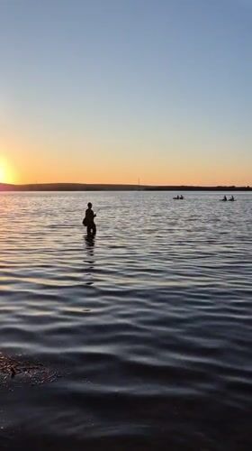 Sunset recreation captured along Voronezh Reservoir waterfront