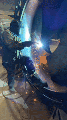 Welder works on metal structure in Zaljevo, Montenegro