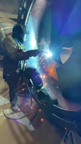 Welder works on metal structure in Zaljevo, Montenegro