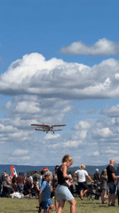 Mixed aircraft flying over Cheb airfield on a sunny afternoon
