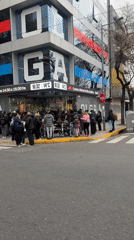 Customers queue outside OLGA store in Buenos Aires