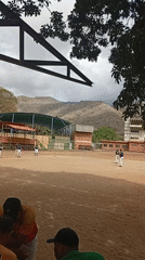 Community baseball game draws spectators in Las Piedras, Venezuela