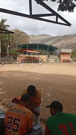 Community baseball game draws spectators in Las Piedras, Venezuela