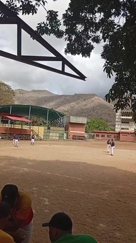 Community baseball game draws spectators in Las Piedras, Venezuela