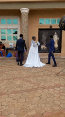 Wedding photoshoot captured outside building in Onitsha, Nigeria