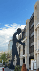 Basel morning streetscape captured through sculptures, transit, architecture