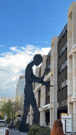 Basel morning streetscape captured through sculptures, transit, architecture