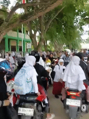 School commute captured on busy Lhokseumawe street