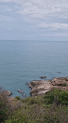 Calm coastal morning documented at Choeng Mon rocky shoreline