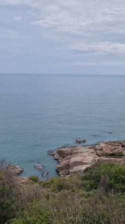 Calm coastal morning documented at Choeng Mon rocky shoreline