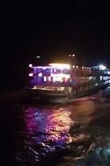 Colorfully lit ferry crosses Bangladesh waters at night