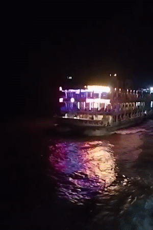 Colorfully lit ferry crosses Bangladesh waters at night