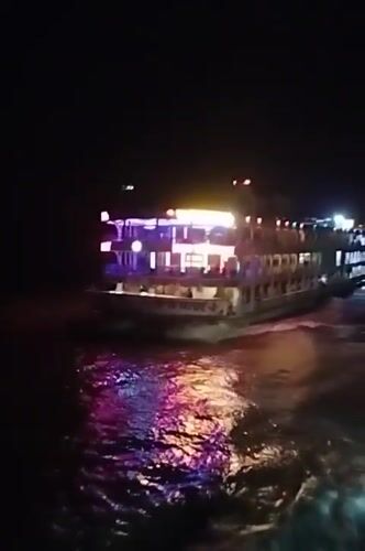 Colorfully lit ferry crosses Bangladesh waters at night