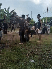 Traditional performance held during rainfall in Karang Tengah, Indonesia