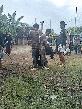 Traditional performance held during rainfall in Karang Tengah, Indonesia