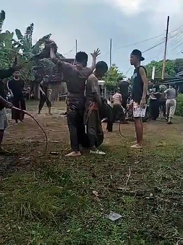 Traditional performance held during rainfall in Karang Tengah, Indonesia