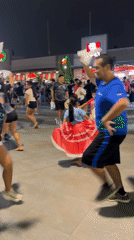 Nighttime band performance draws dancing crowd in Peru plaza