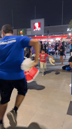 Nighttime band performance draws dancing crowd in Peru plaza