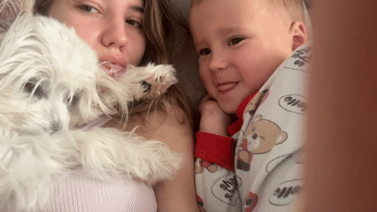 Lazy afternoon at home with a fluffy white dog
