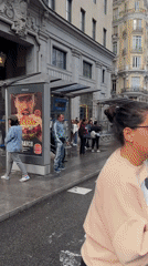 Madrid scenes capture parade, rain shower, and street encounter