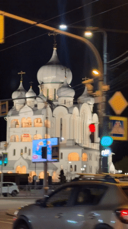 Illuminated Orthodox church observed at night in Saint Petersburg