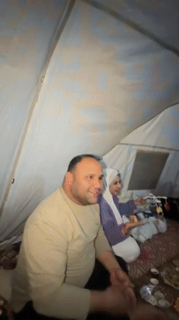 Groups gather inside tent for meals and social time