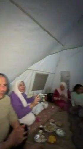 Groups gather inside tent for meals and social time