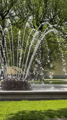 Spring day documented in Saint Petersburg park with fountain, flowers