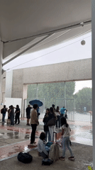 Students shelter from heavy rain at Puebla educational facility