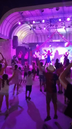 Evening dance event lights up Caorle under purple stage glow