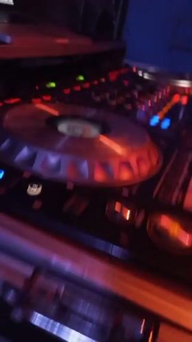 DJ performs at dimly lit venue in Lokoja, Nigeria