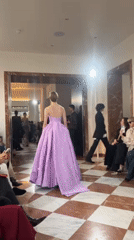 Fashion show featuring evening gowns held in London