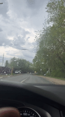 Driver navigates rainy roads in Vasil'yevo, Russia
