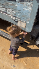 Daily survival in a Gaza displacement camp, water and debris.