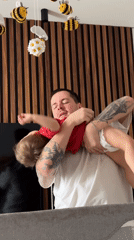 Man comforts toddler in Odintsovo home