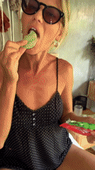 Woman enjoys green macaron in North Kuta indoor venue