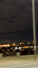 Night cityscape captured along illuminated St. Petersburg riverfront