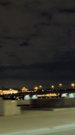 Night cityscape captured along illuminated St. Petersburg riverfront