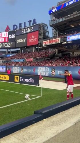Soccer match at Yankee Stadium, red and white kits