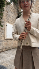 Street musician with flute spotted in Budva old town